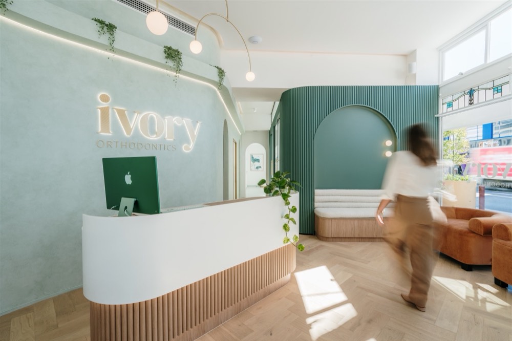 Reception fitout with pendant and signage lighting